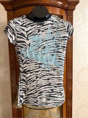 Vintage Crash 💥 and Burn burn outGraphic Zebra Print Tee with Blue Pegasus Motif
